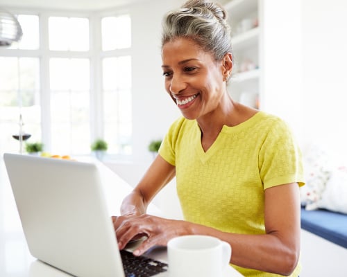 woman sitting down using the computer